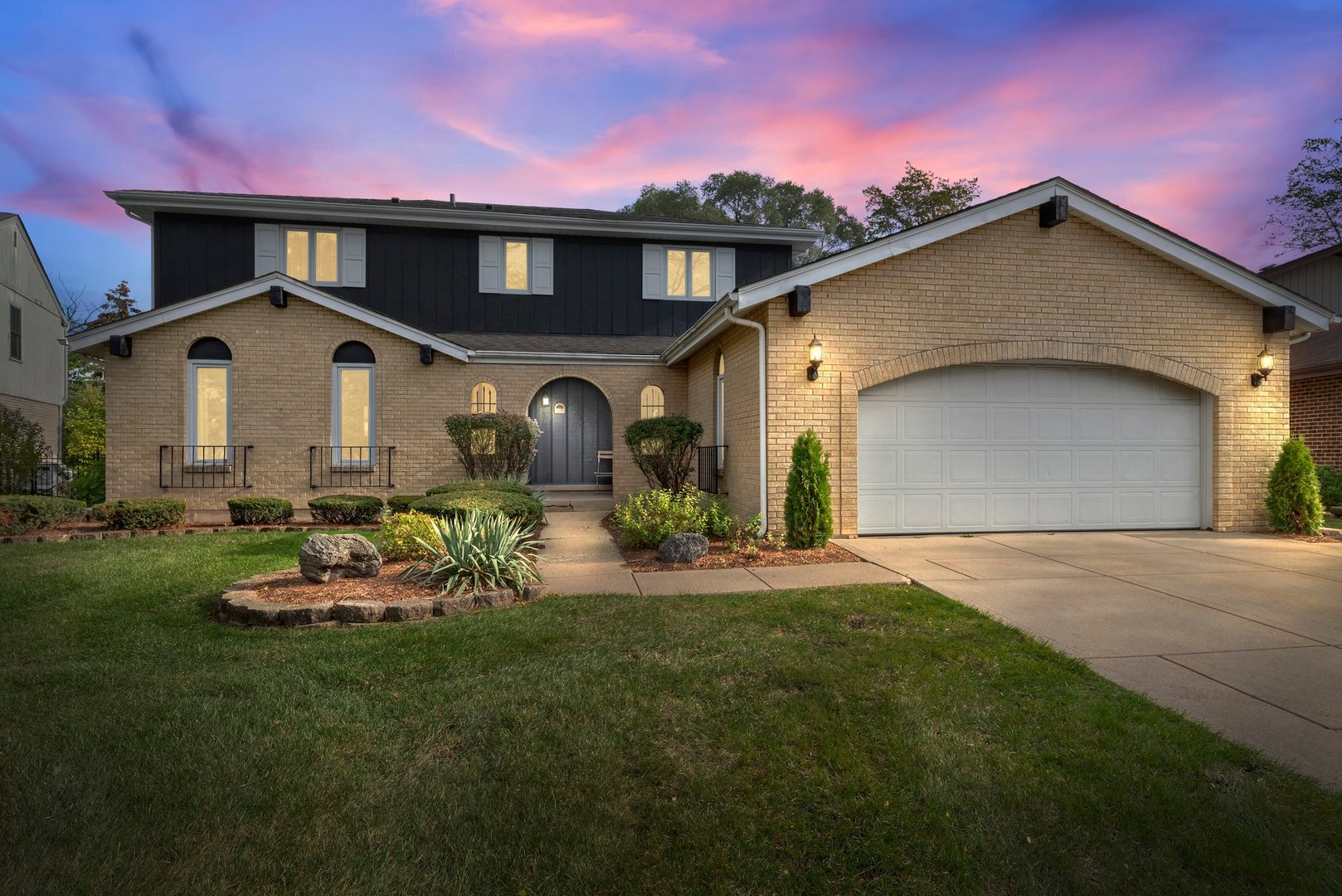 1133 Old Fence Road Addison, IL 60101 - Photo 1 of 29 a front view of a house with a garden and yard