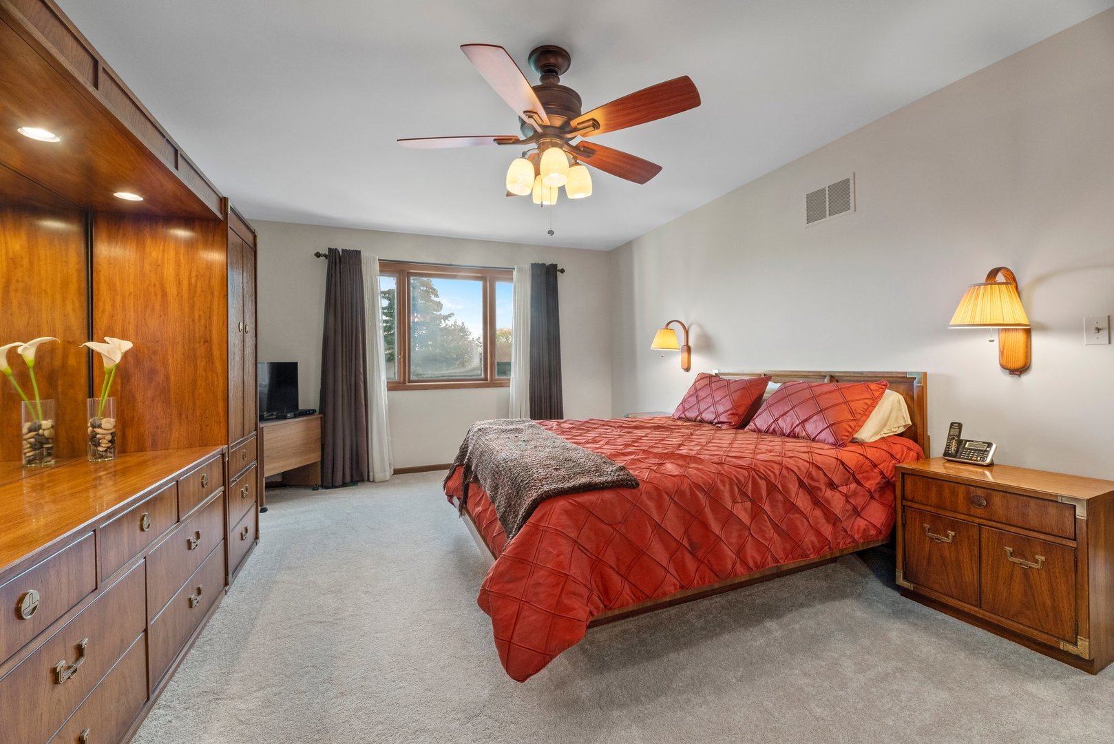 1133 Old Fence Road Addison, IL 60101 - Photo 15 of 29 a bedroom with a bed and a chandelier