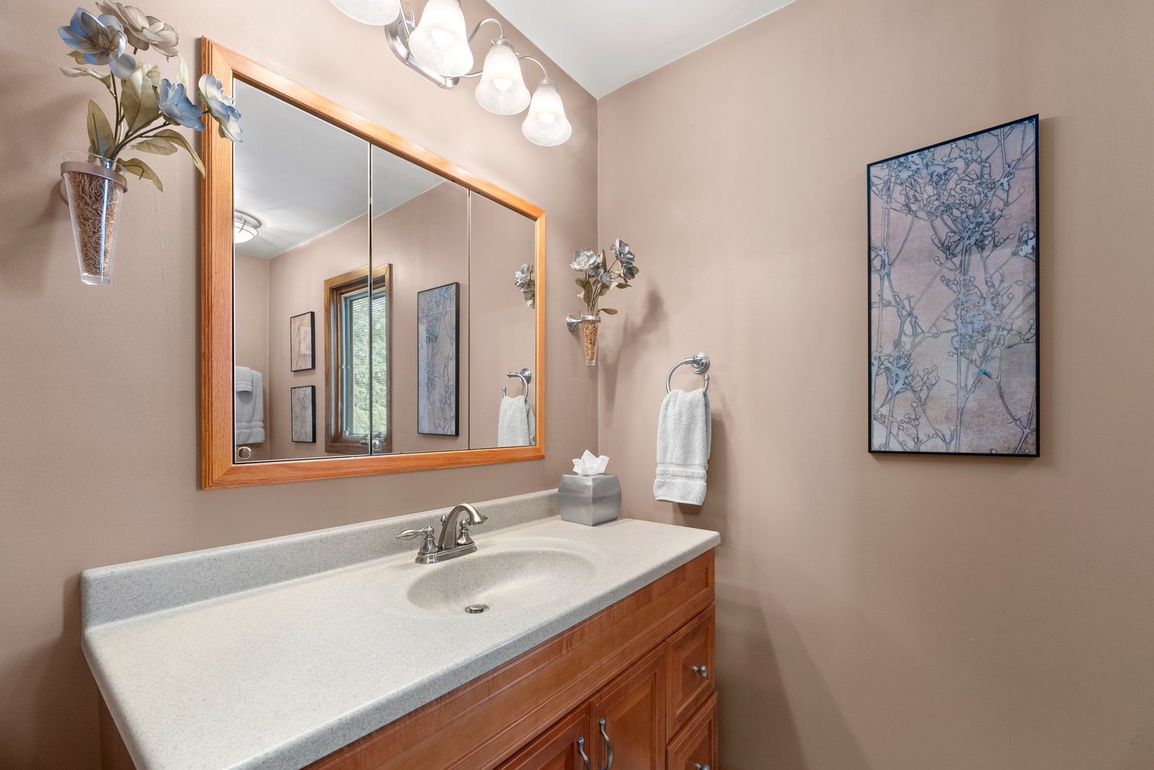 1133 Old Fence Road Addison, IL 60101 - Photo 20 of 29 a bathroom with a sink and a mirror