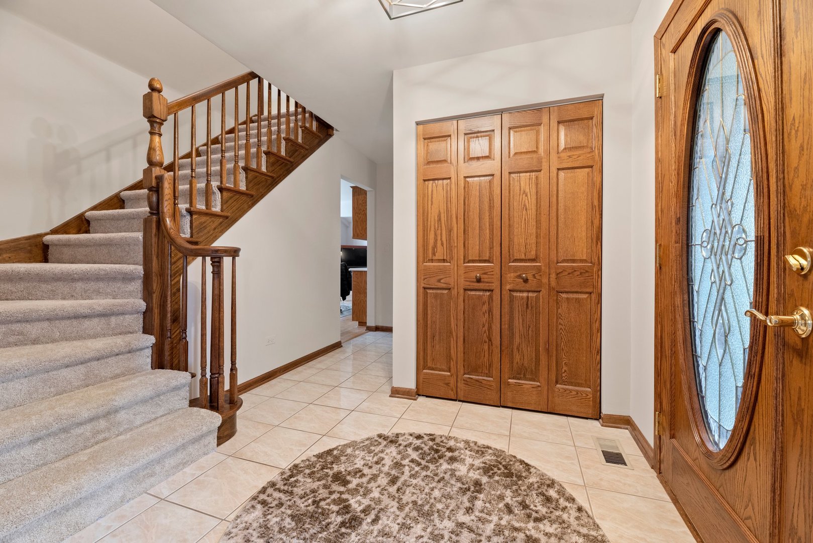1133 Old Fence Road Addison, IL 60101 - Photo 3 of 29 a view of entryway with wooden floor and stairs