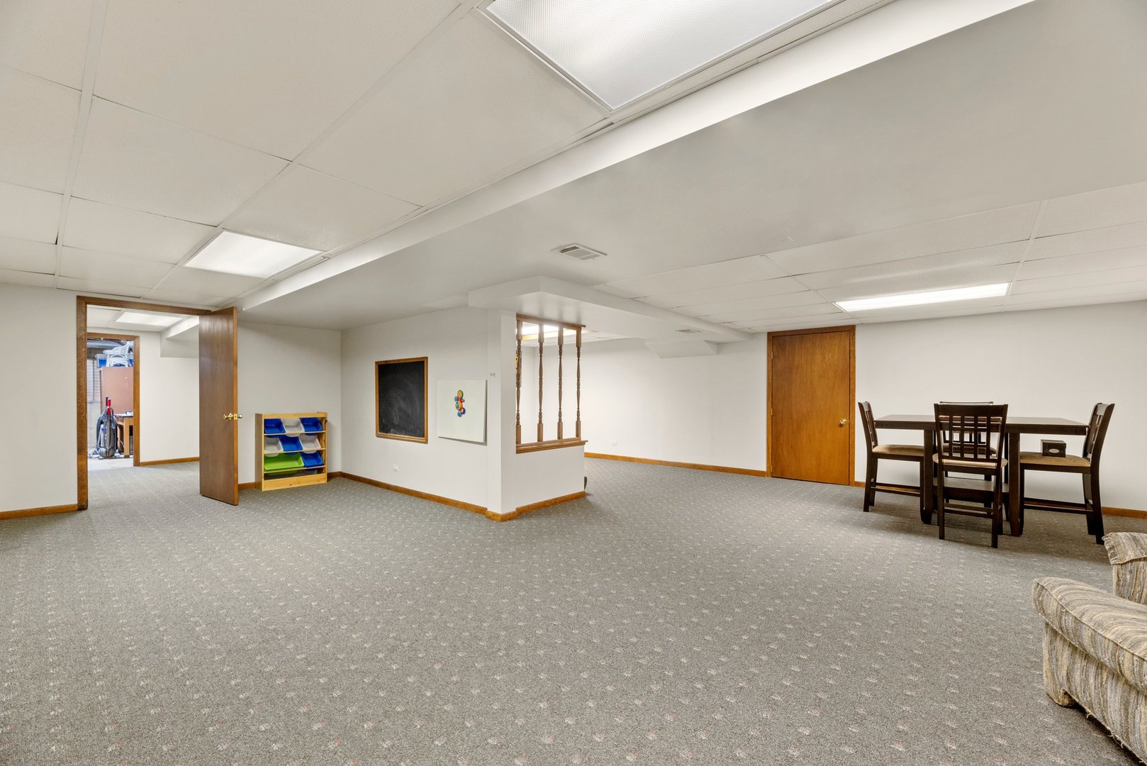 1133 Old Fence Road Addison, IL 60101 - Photo 22 of 29 a view of a livingroom with furniture and a ceiling fan