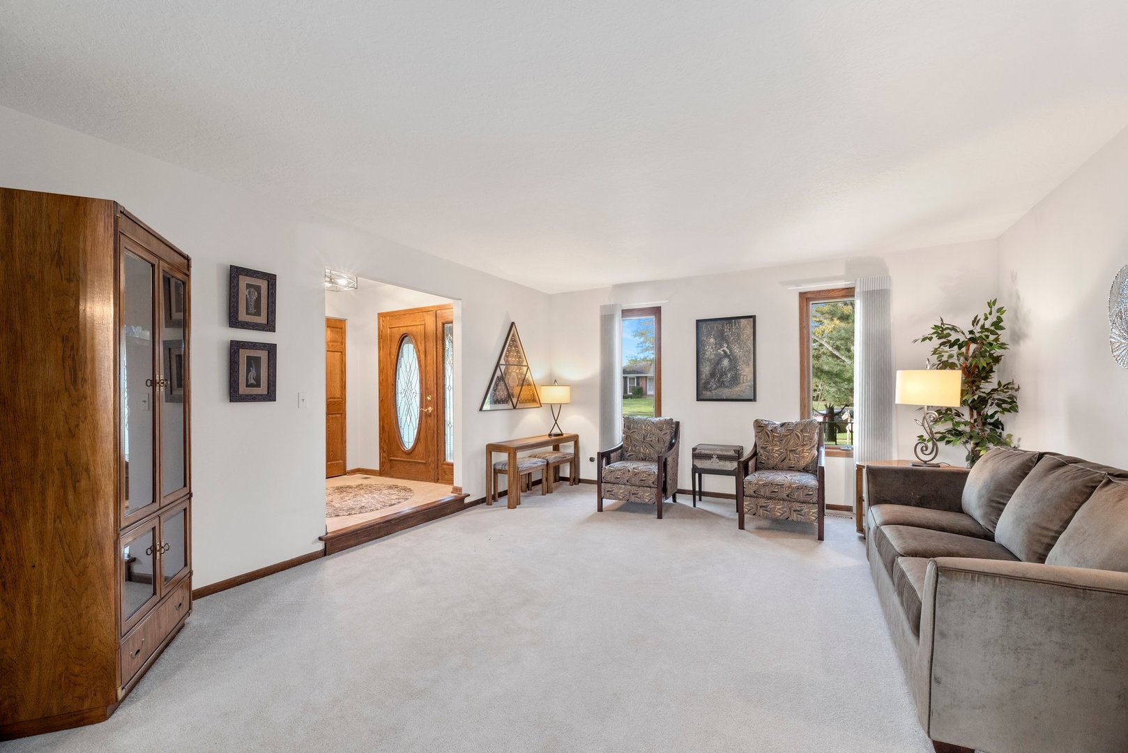 1133 Old Fence Road Addison, IL 60101 - Photo 4 of 29 a living room with furniture and large windows