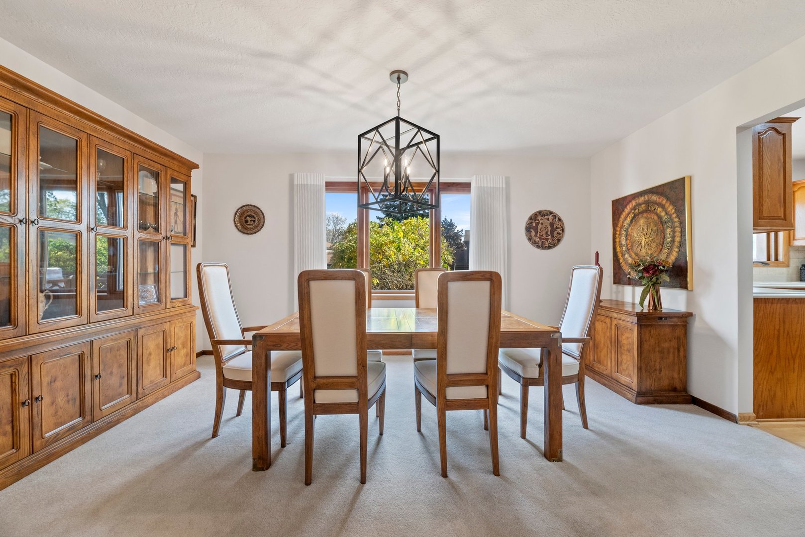 1133 Old Fence Road Addison, IL 60101 - Photo 6 of 29 a dining room with furniture a livingroom and chandelier
