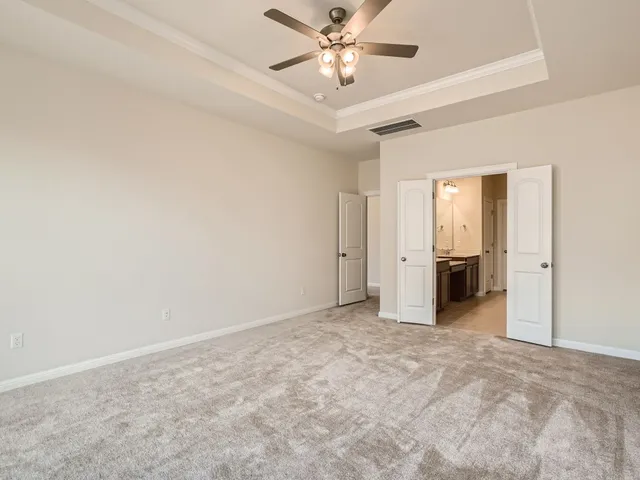 a view of a livingroom with a ceiling fan