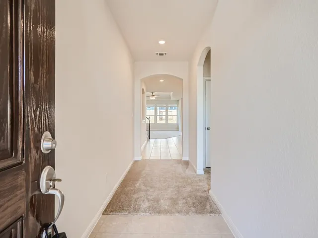 a view of a hallway with windows