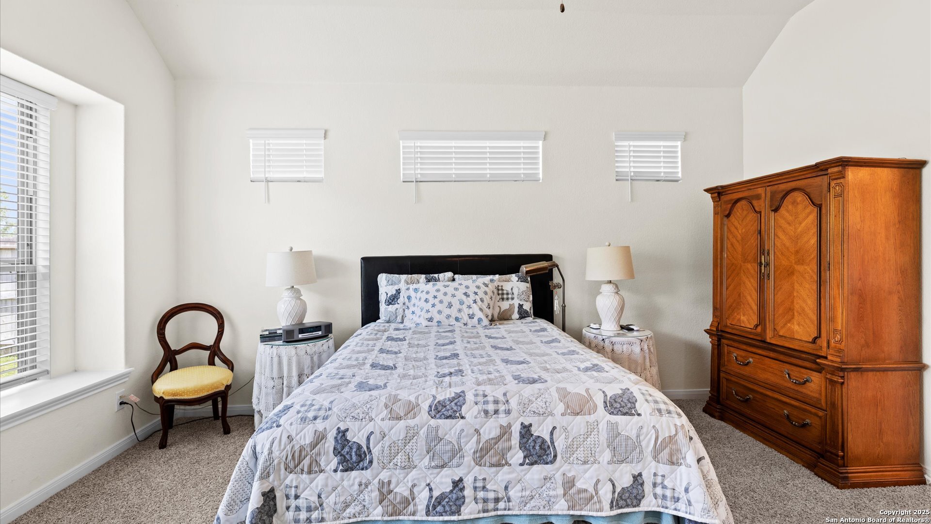 425 Foxbrook Way Cibolo, TX 78108 - Photo 11 of 29 a large bed sitting in a bedroom next to a window