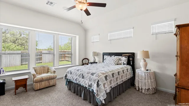 a bedroom with a bed and a couch