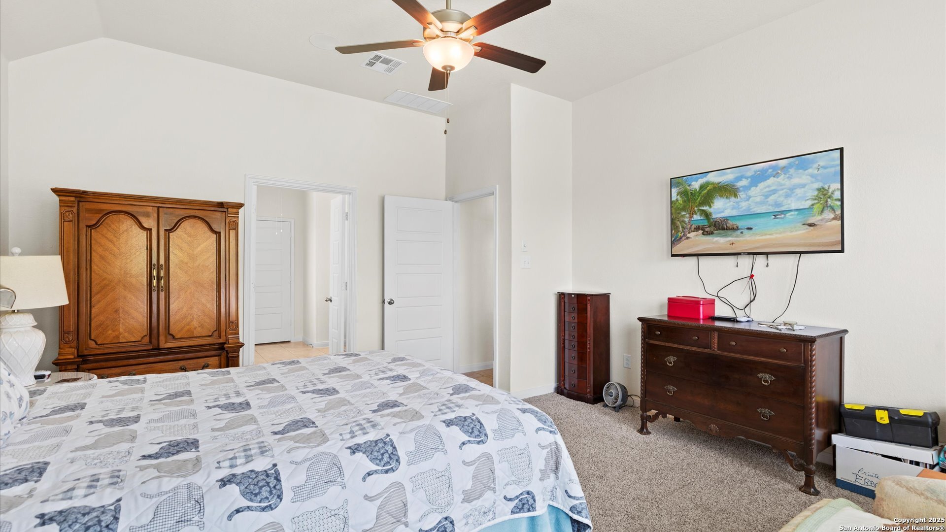 425 Foxbrook Way Cibolo, TX 78108 - Photo 13 of 29 a bedroom with a bed and a chandelier
