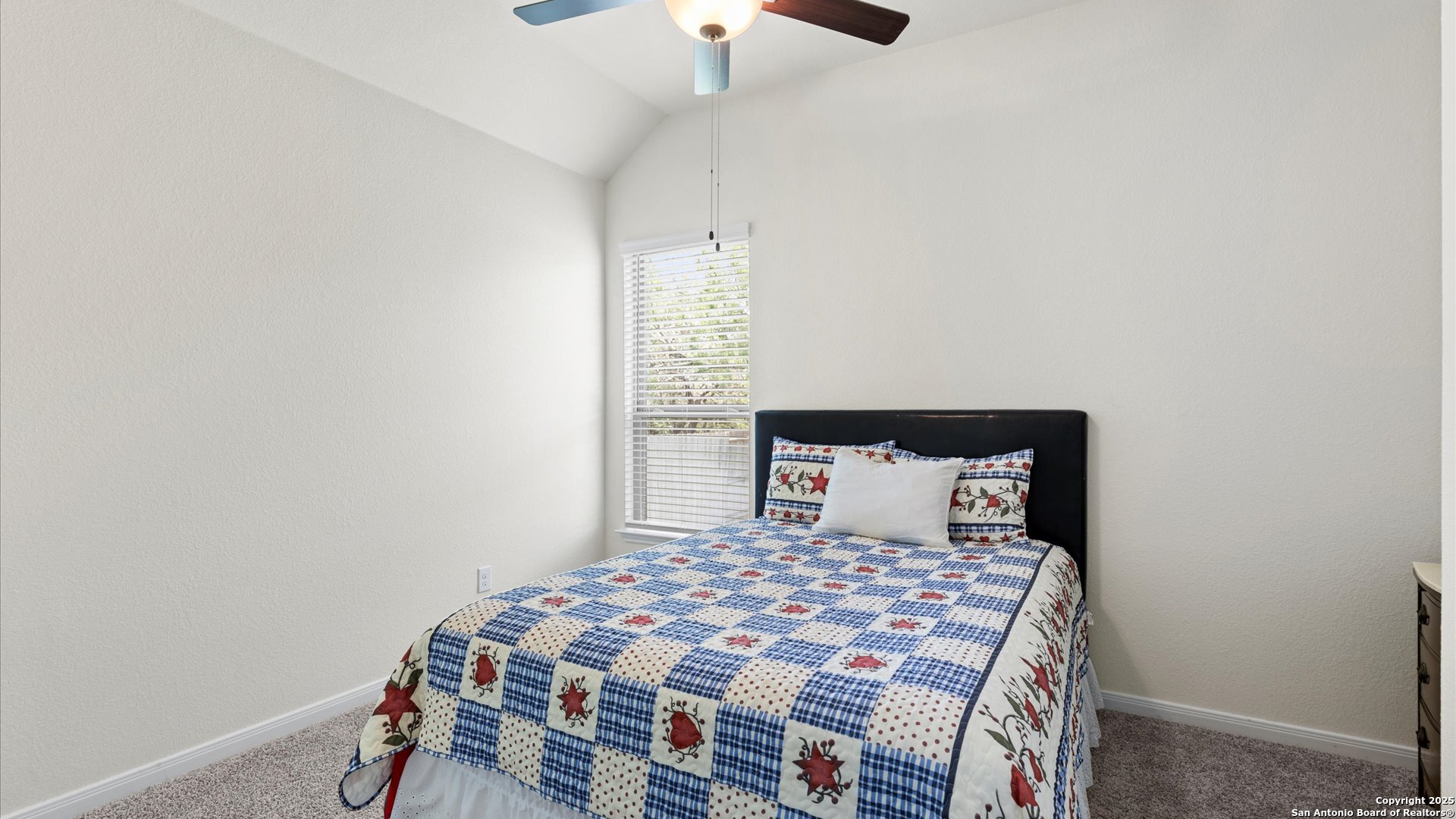 425 Foxbrook Way Cibolo, TX 78108 - Photo 23 of 29 a bedroom with a bed and a lamp