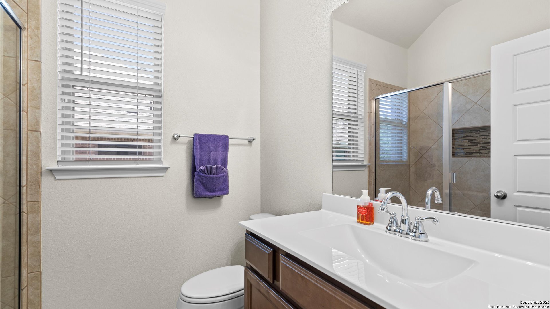 425 Foxbrook Way Cibolo, TX 78108 - Photo 26 of 29 a bathroom with a sink toilet and vanity