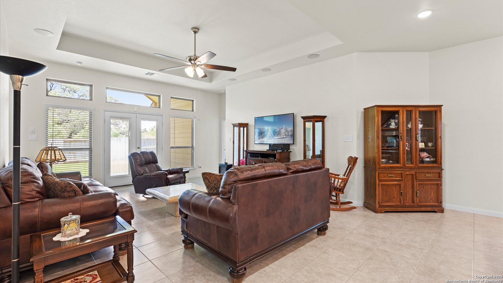 425 Foxbrook Way Cibolo, TX 78108 - Photo 9 of 29 a living room with furniture a ceiling fan and a window