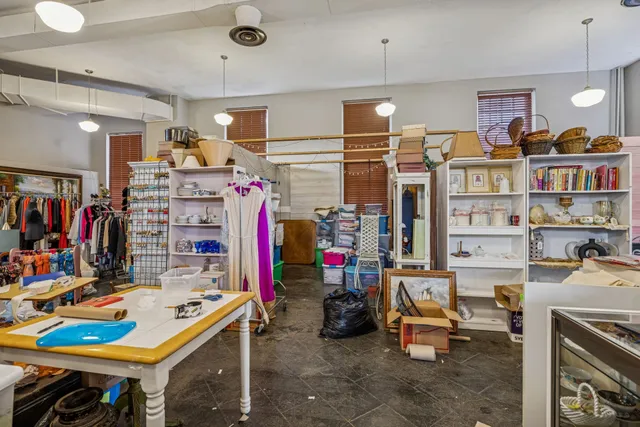a view of walk in closet with clothes