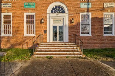 a view of a brick house with a large windows