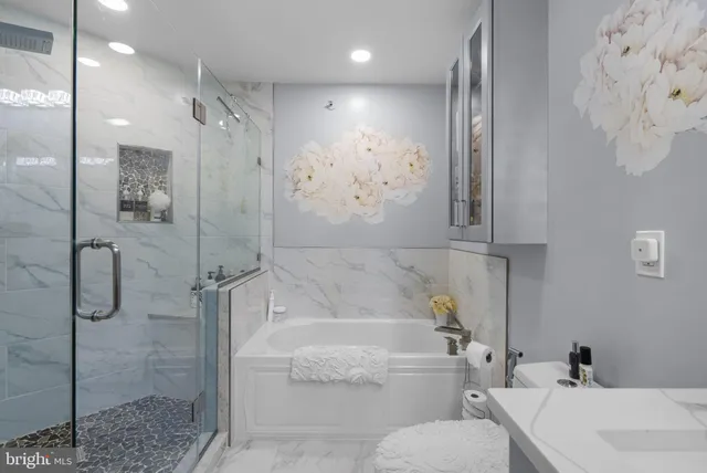 a bathroom with a bathtub and a shower