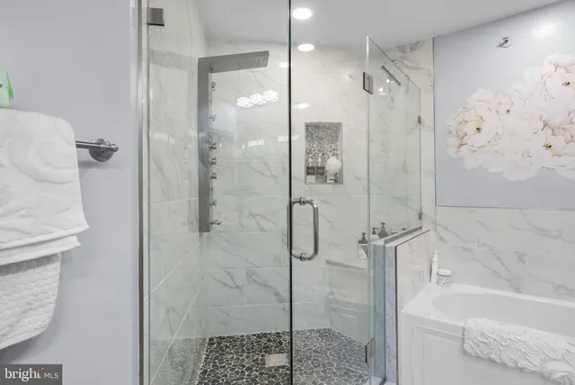 a bathroom with a shower and a sink