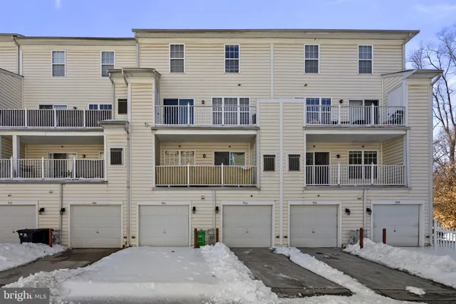 a front view of a building with a yard