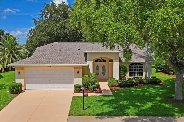 a view of a garden with a building in the background