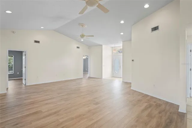 a kitchen with stainless steel appliances granite countertop a refrigerator sink and cabinets