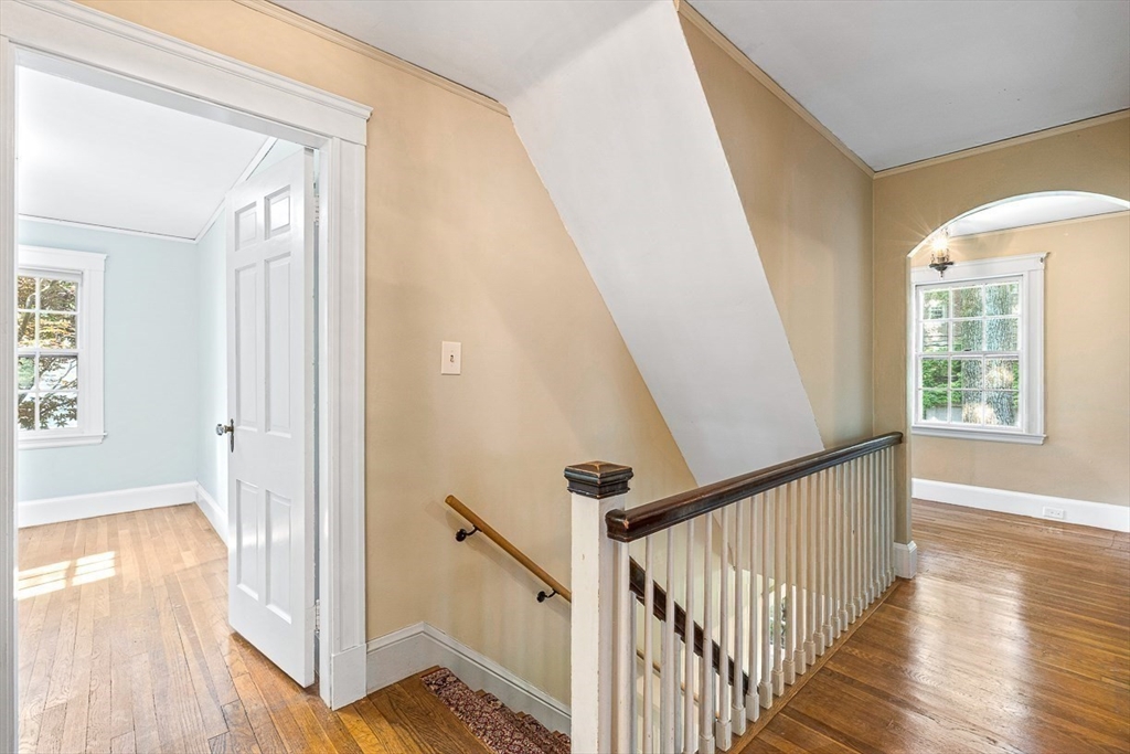 17 Colburn Road Wellesley, MA 02481 - Photo 18 of 30 a view of a hallway with wooden floor and stairs