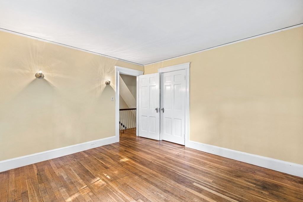 17 Colburn Road Wellesley, MA 02481 - Photo 23 of 30 a view of empty room with wooden floor and fan