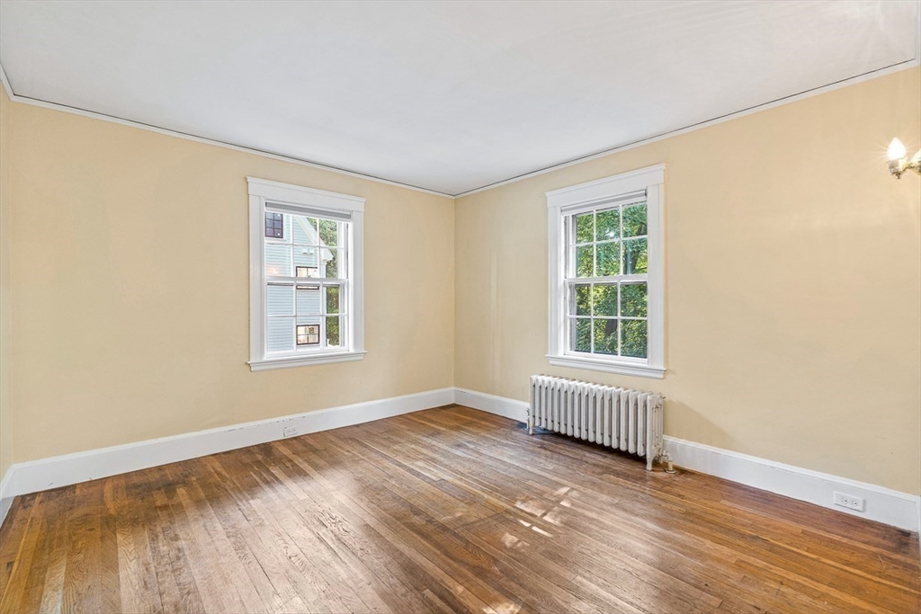 17 Colburn Road Wellesley, MA 02481 - Photo 24 of 30 an empty room with wooden floor and windows