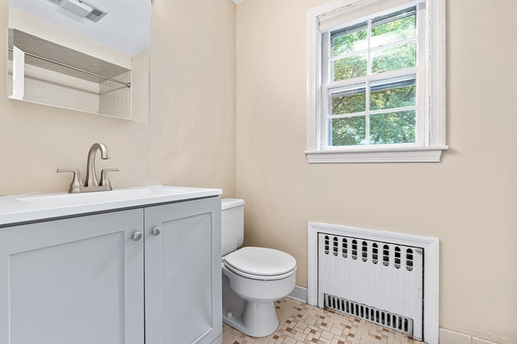 17 Colburn Road Wellesley, MA 02481 - Photo 25 of 30 a bathroom with a toilet a sink and a window