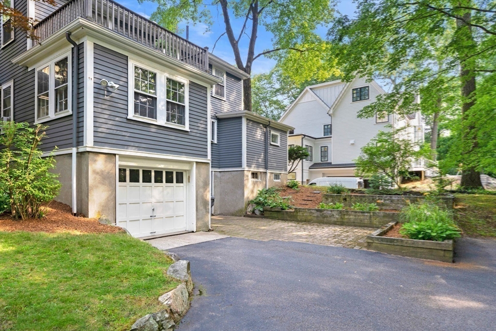 17 Colburn Road Wellesley, MA 02481 - Photo 28 of 30 a front view of a house with a yard and garage