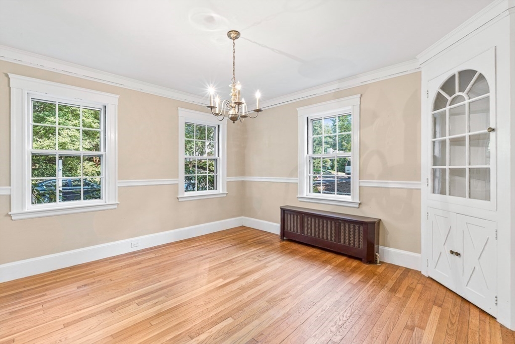 17 Colburn Road Wellesley, MA 02481 - Photo 10 of 30 a view of an empty room with wooden floor and a window