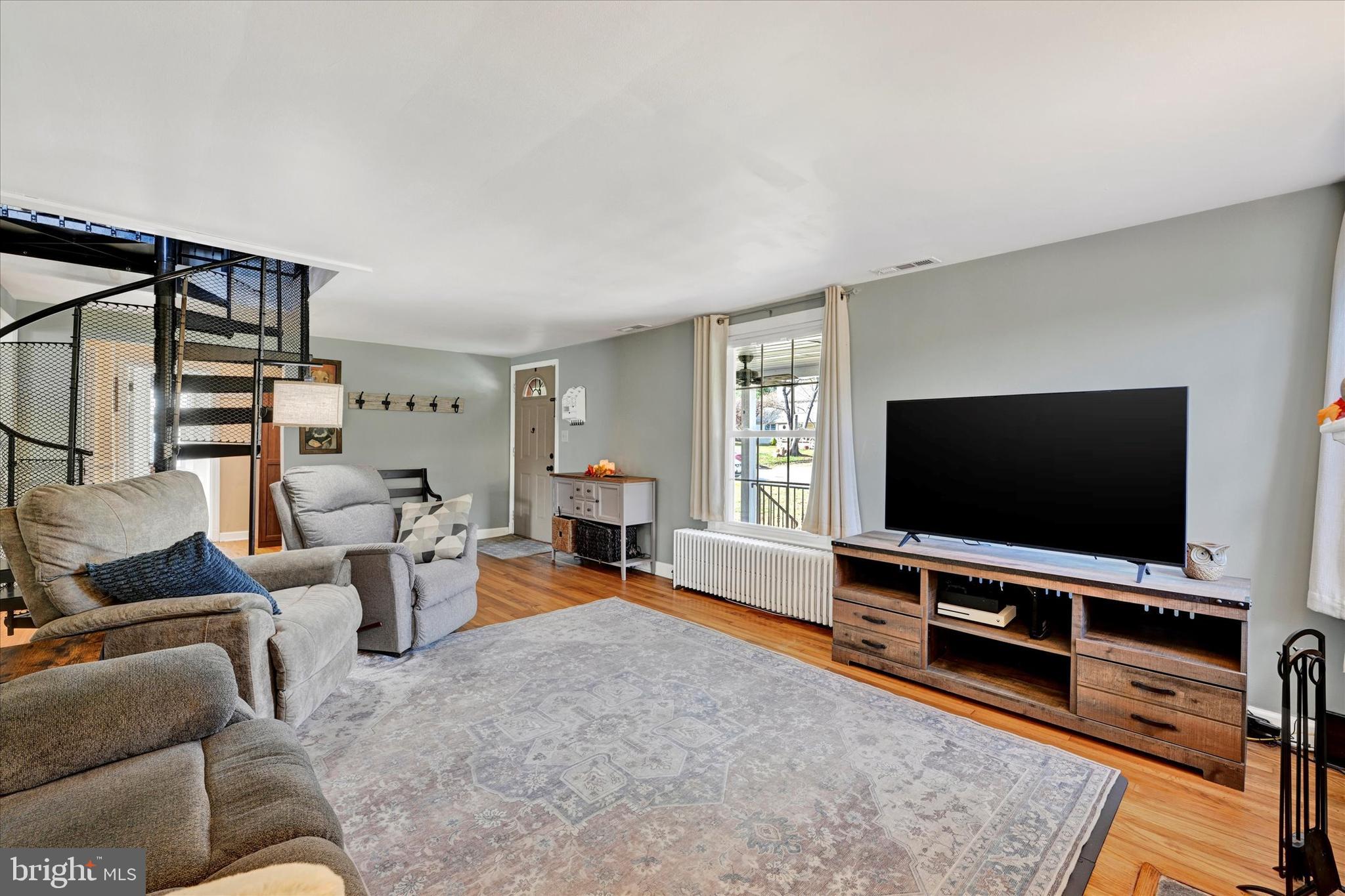 9 Othoridge Road Lutherville-Timonium, MD 21093 - Photo 17 of 37 a living room with furniture and a flat screen tv
