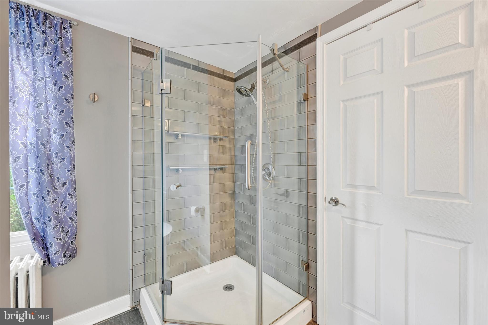 9 Othoridge Road Lutherville-Timonium, MD 21093 - Photo 22 of 37 a bathroom with a shower and a sink