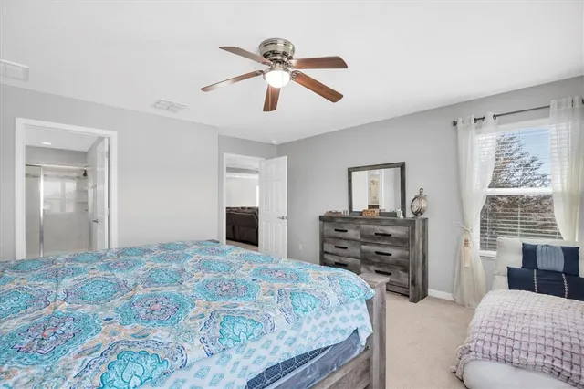 a bathroom with a tub a sink shower and mirror