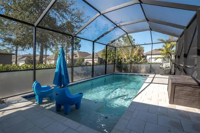 a view of a house with a yard porch and sitting area