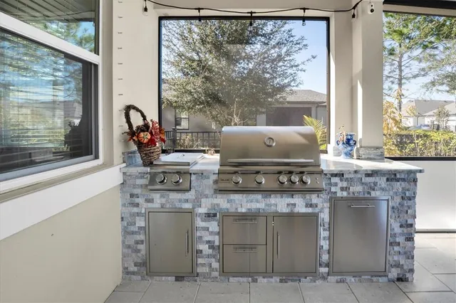 a living room with furniture and kitchen view