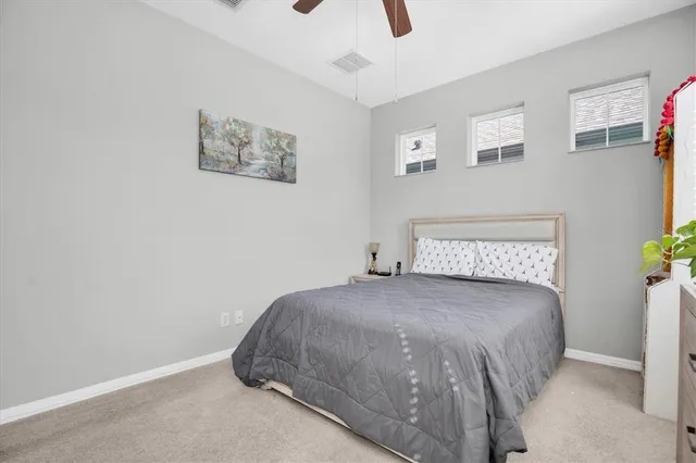 a view of a dining room with furniture and a chandelier