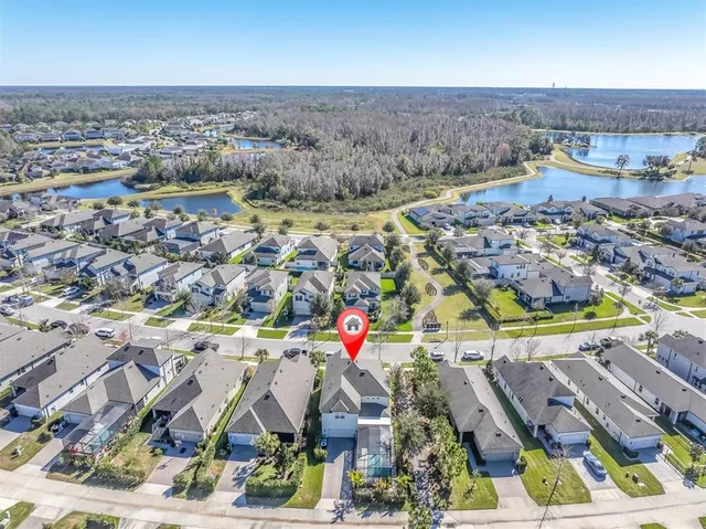 an aerial view of residential houses with outdoor space