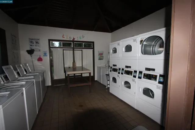 a view of a hallway view of wooden floor and kitchen