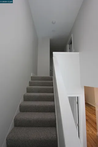 a view of hallway with an empty room