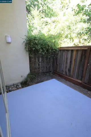 a view of backyard with furniture and trees