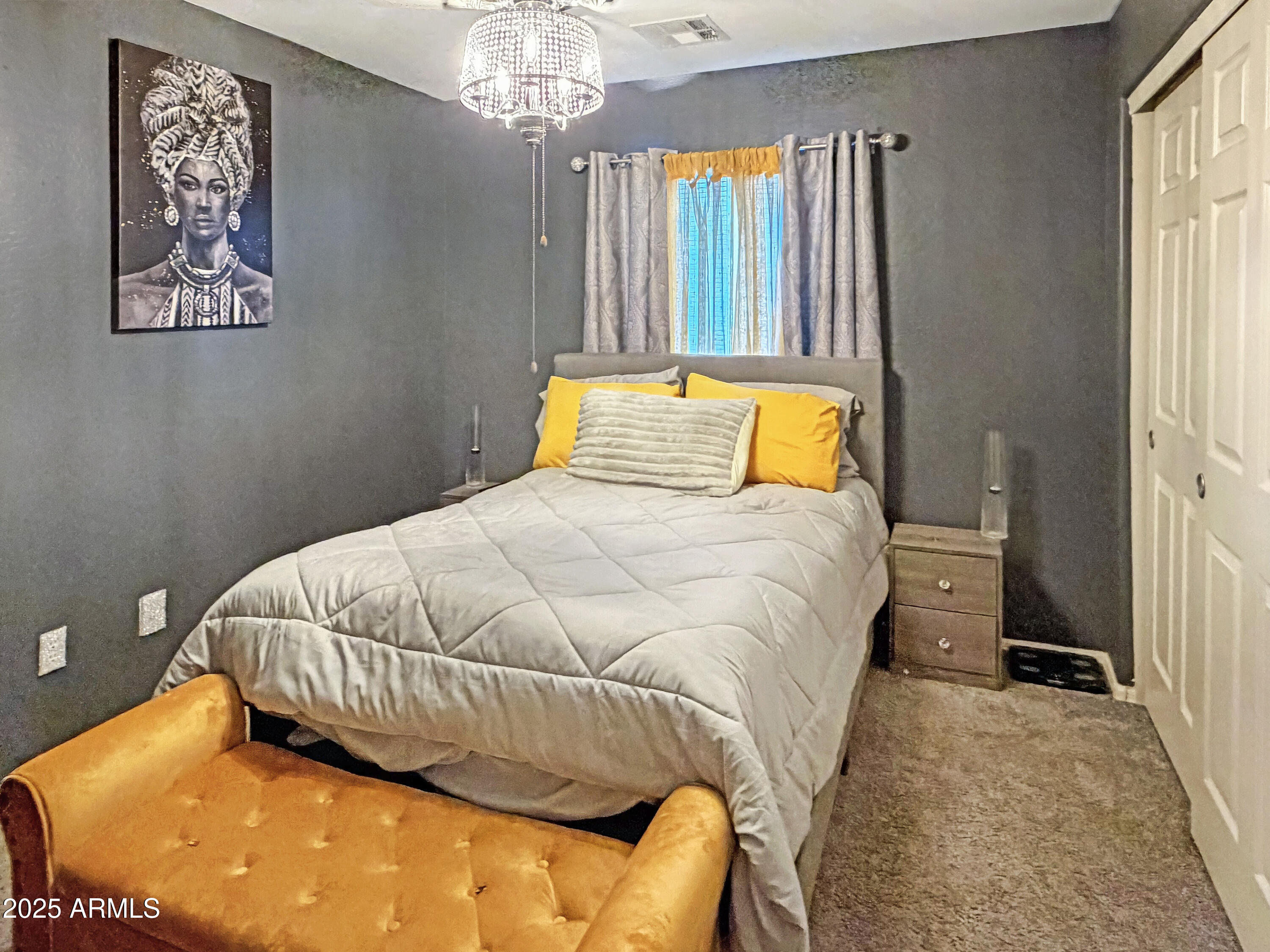 166 South 18 TH Street Coolidge, AZ 85128 - Photo 14 of 31 a bedroom with a bed and a chandelier