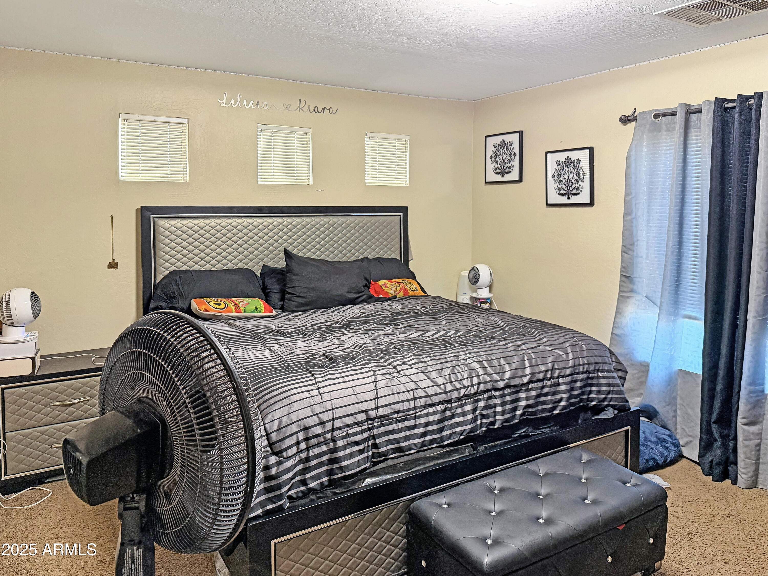 166 South 18 TH Street Coolidge, AZ 85128 - Photo 16 of 31 a bedroom with a bed and wooden floor