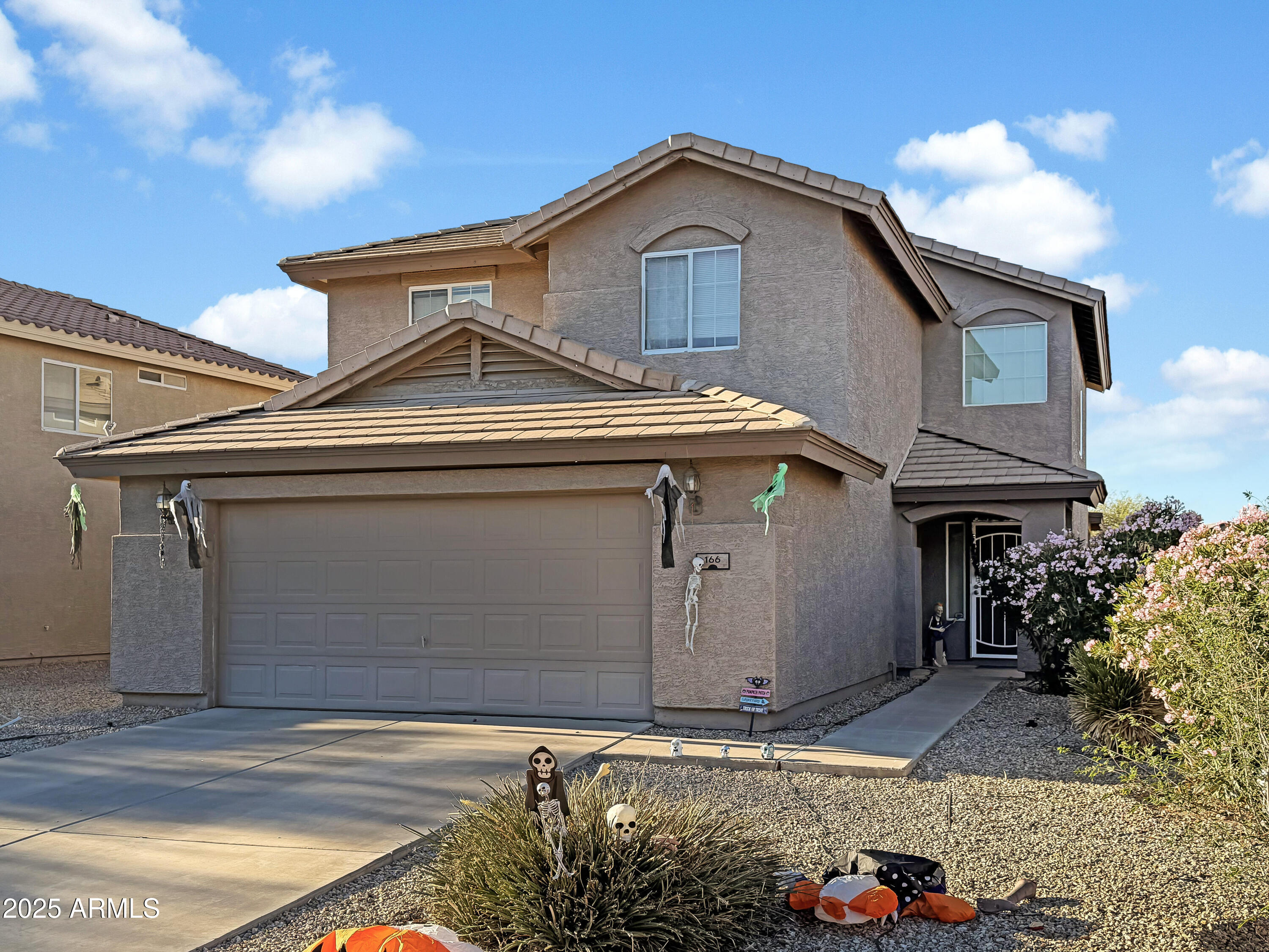 166 South 18 TH Street Coolidge, AZ 85128 - Photo 2 of 31 a front view of a house with a yard