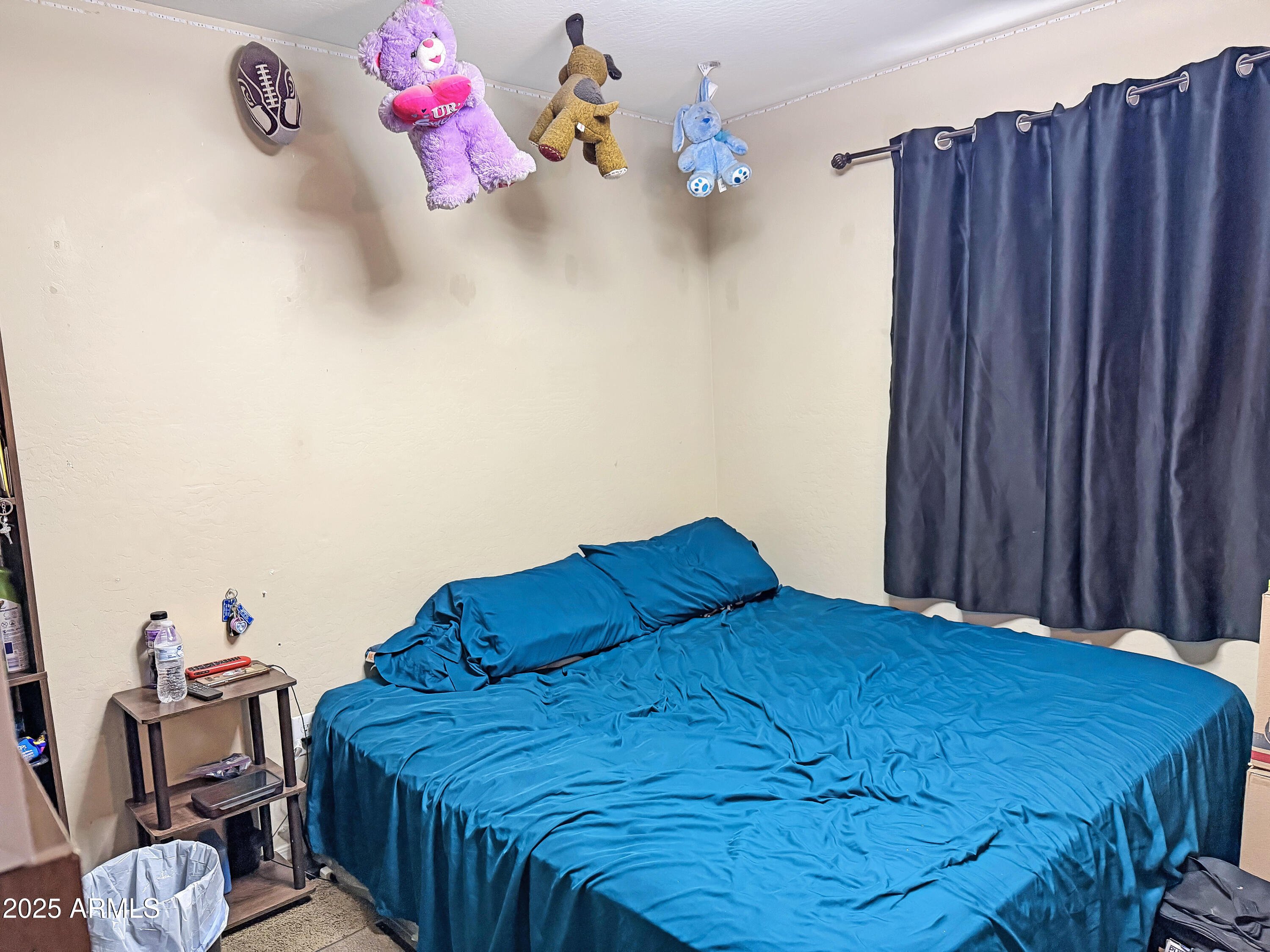 166 South 18 TH Street Coolidge, AZ 85128 - Photo 23 of 31 a bedroom with a bed and wooden floor