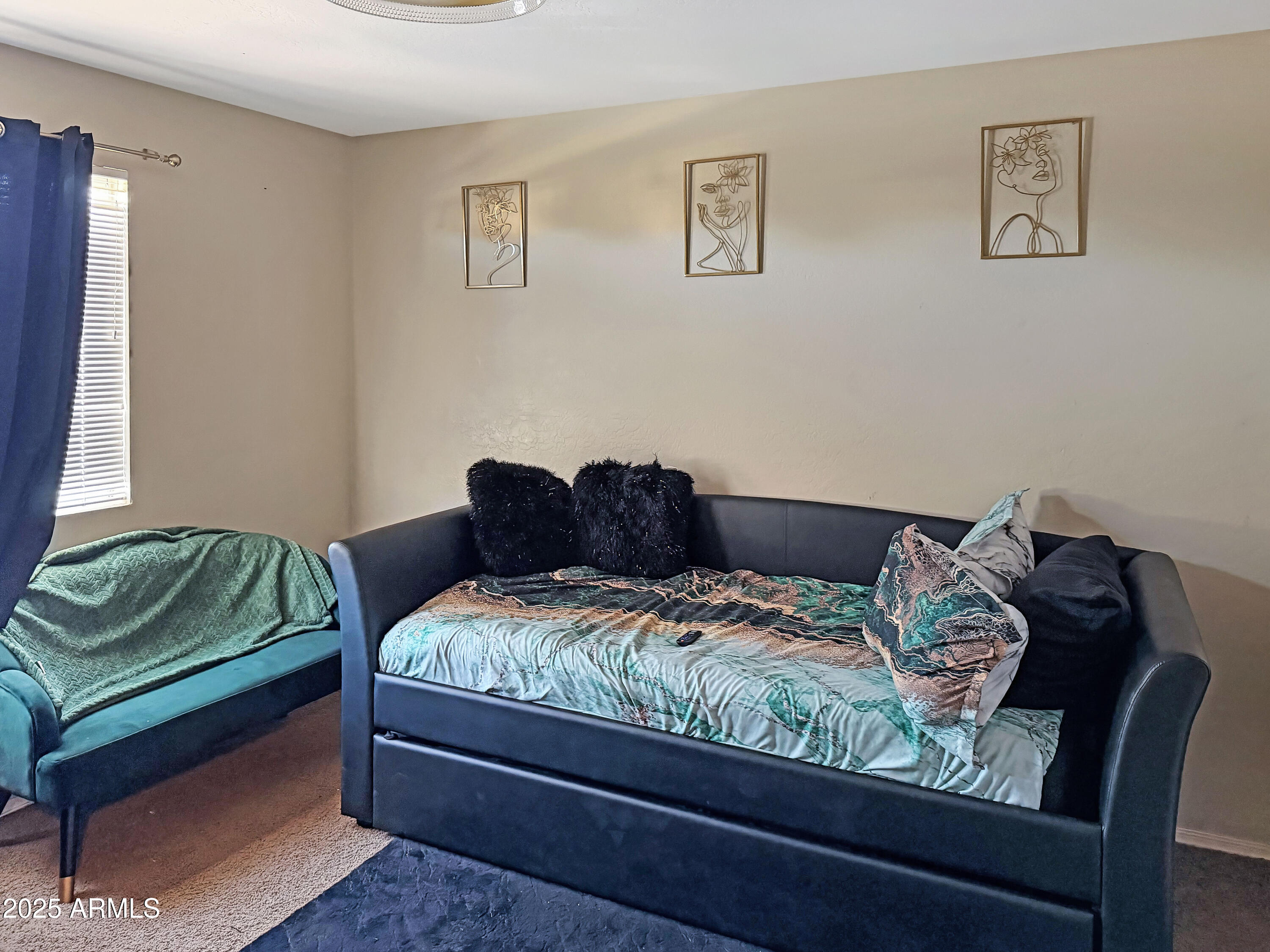 166 South 18 TH Street Coolidge, AZ 85128 - Photo 24 of 31 a bedroom with a bed and a chair