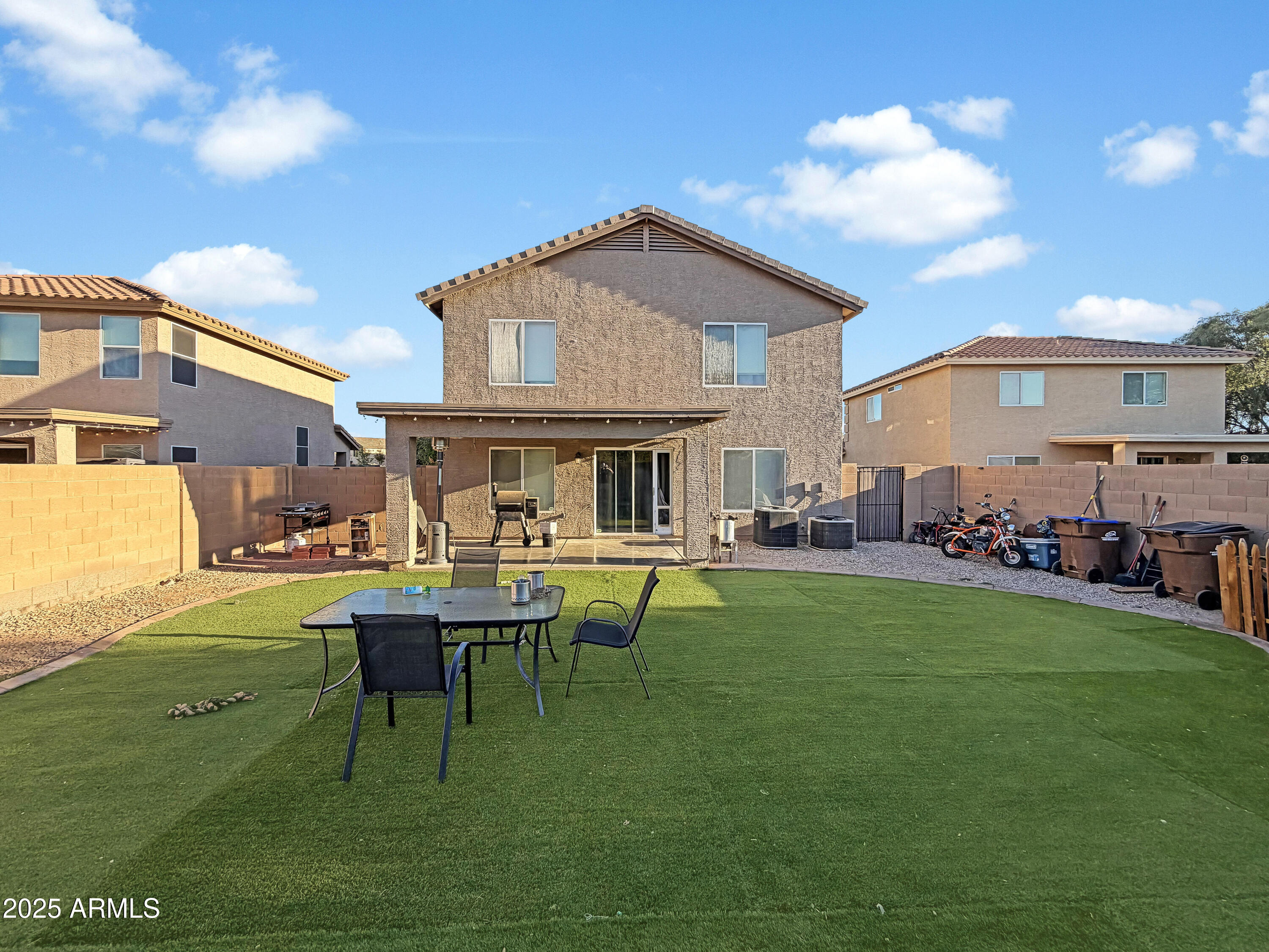 166 South 18 TH Street Coolidge, AZ 85128 - Photo 25 of 31 a backyard of a house with table and chairs