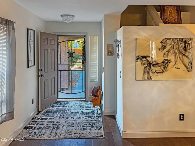 a kitchen with a table chairs stove and cabinets