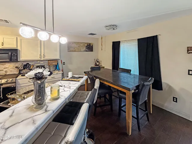a kitchen with a stove sink and cabinets