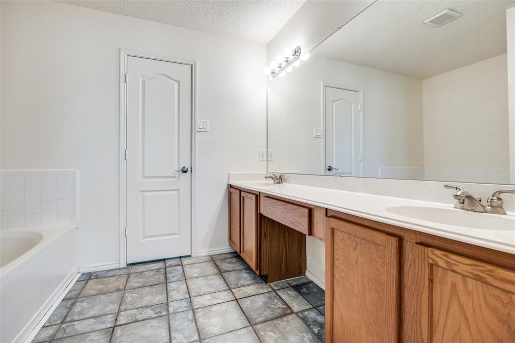 1026 County Road 544 Nevada, TX 75173 - Photo 15 of 32 a bathroom with a sink and a mirror