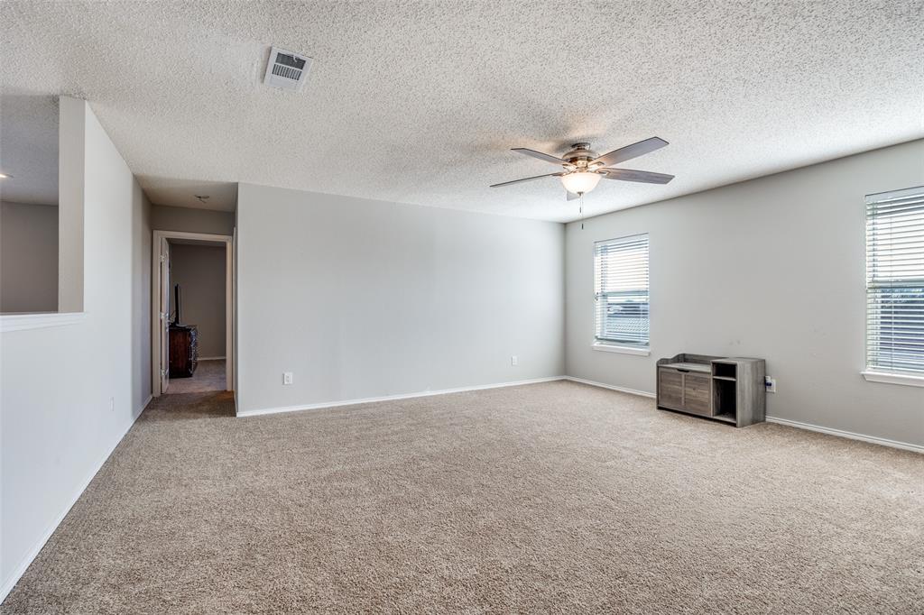1026 County Road 544 Nevada, TX 75173 - Photo 17 of 32 an empty room with windows and fan