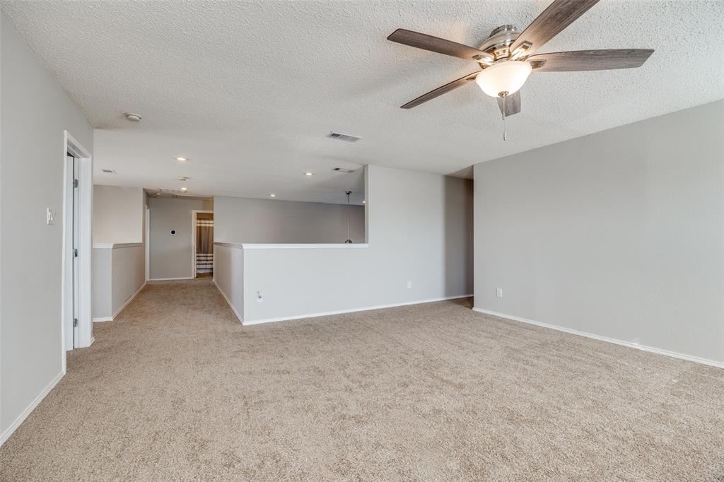 1026 County Road 544 Nevada, TX 75173 - Photo 18 of 32 an empty room with a ceiling fan and a ceiling fan