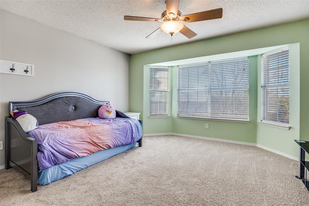 1026 County Road 544 Nevada, TX 75173 - Photo 23 of 32 a bedroom with a bed and a large window